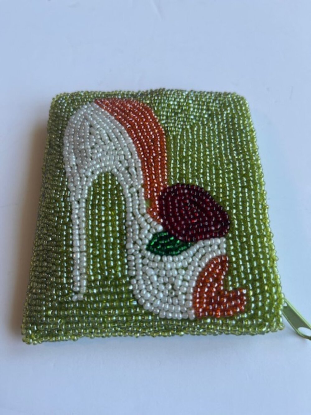 Hand beaded mini bag with shoe decal.